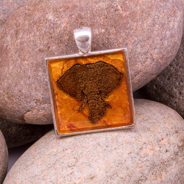 Handcrafted Bespoke Majestic Elephant Pendant; set in silver effect metal bezel.| Jabbawocky Crafts (jabbawockycrafts.co.uk)