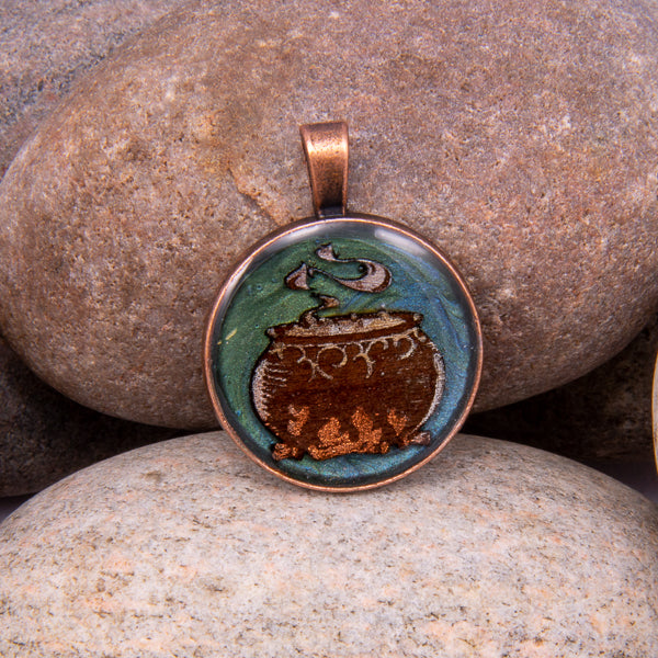 Handcrafted Bespoke Witches Cauldren Pendant; set in Copper Effect metal bezel.| Jabbawocky Crafts (jabbawockycrafts.co.uk)